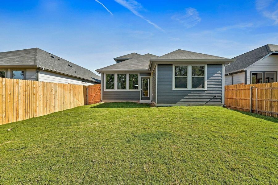 Exterior details and patio area of a home in Trinity Ranch, Elgin (Image 23).