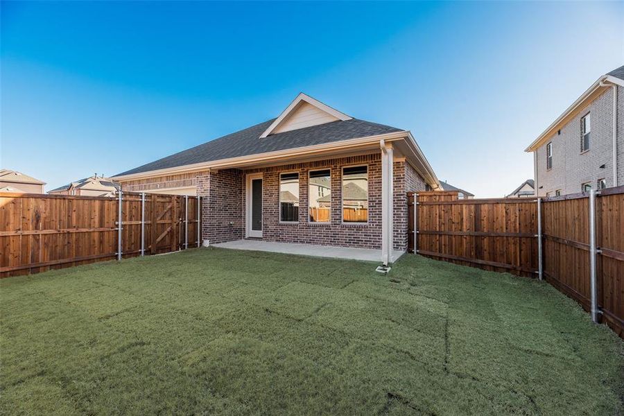 Exterior details and patio area of a home in Villages of Creekwood, Frisco (Image 19).