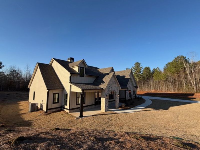 Front exterior of a new home in Harmon Springs, Carrollton, GA, highlighting curb appeal (Image 28).