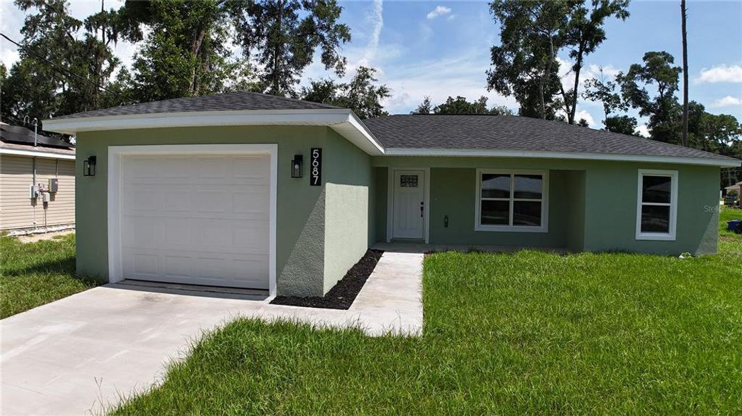 Front exterior of a new home in , Ocala, FL, highlighting curb appeal (Image 2). Front exterior of a new home in , Ocala, FL, highlighting curb appeal (Image 2).