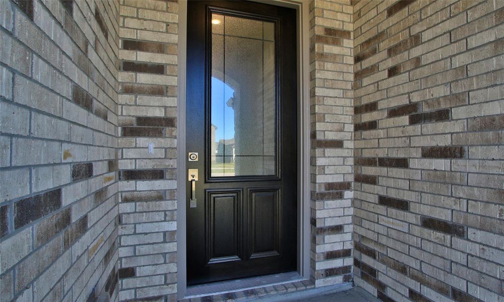 Exterior details and patio area of a home in Sunterra, Katy (Image 18).