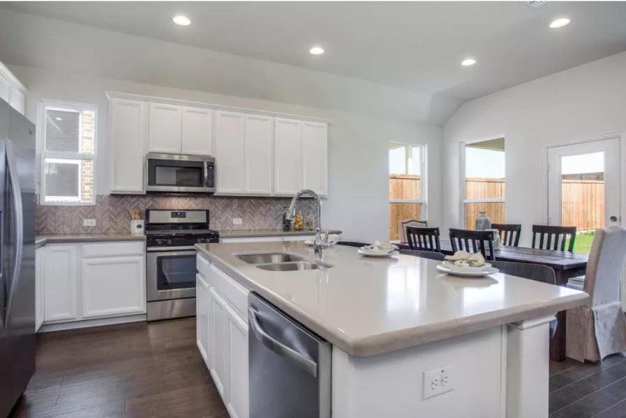 Photo of Pulte model home with same floor plan, not of actual home listed.