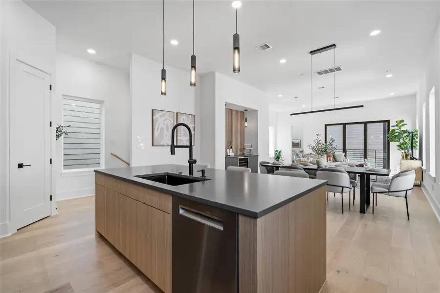 With uninterrupted flow from the island to the dining and living areas, the second floor is designed for connection. Whether entertaining or enjoying a quiet evening in, this open-concept layout brings effortless hospitality to the forefront—anchored by warm finishes, clean lines, and layered lighting that adapts as easily as the moments it holds. With uninterrupted flow from the island to the dining and living areas, the second floor is designed for connection. Whether entertaining or enjoying a quiet evening in, this open-concept layout brings effortless hospitality to the forefront—anchored by warm finishes, clean lines, and layered lighting that adapts as easily as the moments it holds.