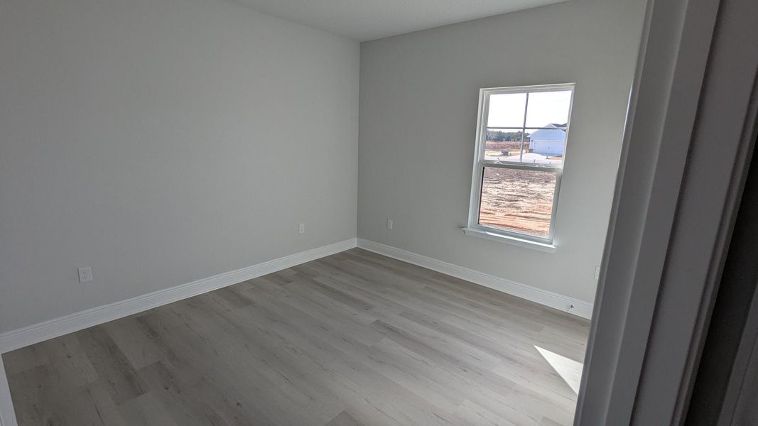 Spacious, unfurnished interior of a new home in The Bluffs at Lafayette, Freeport (Image 11).