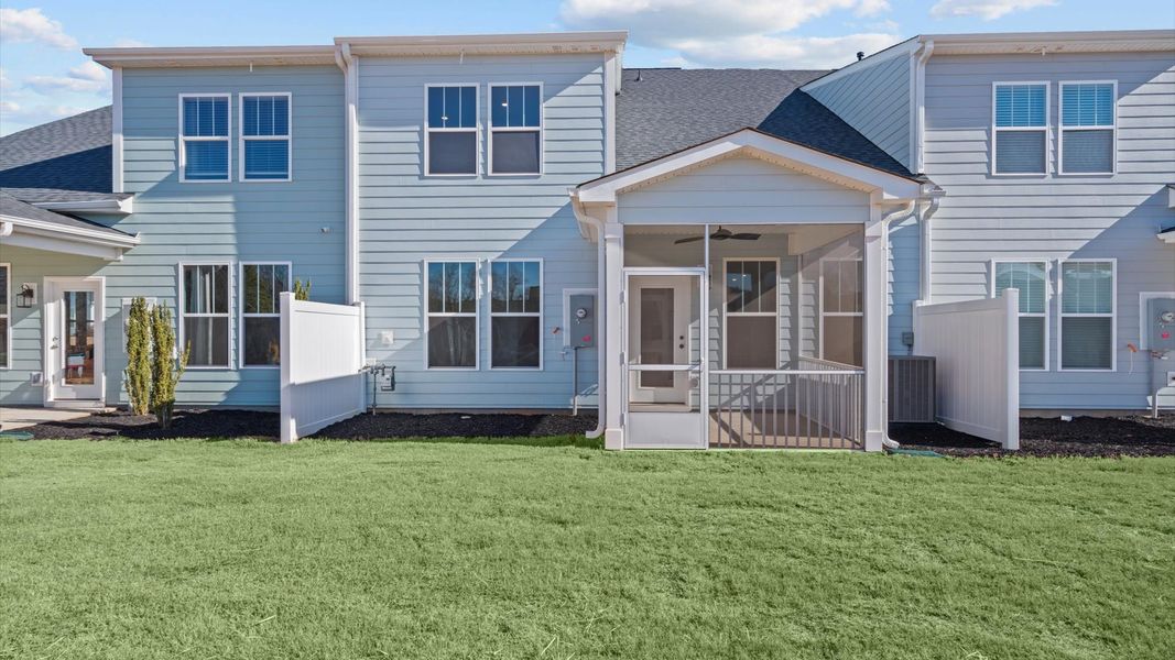 Exceptional outdoor living begins with a screened in back porch in this thoughtfully designed home
