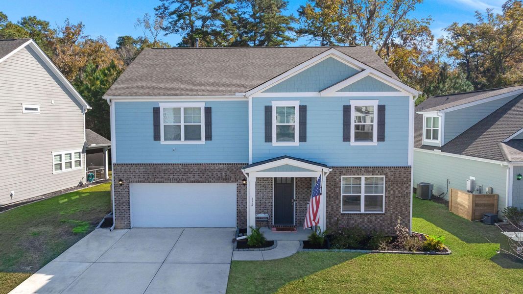 Front exterior of a new home in The Ponds, Summerville, SC, highlighting curb appeal (Image 21). Front exterior of a new home in The Ponds, Summerville, SC, highlighting curb appeal (Image 21).