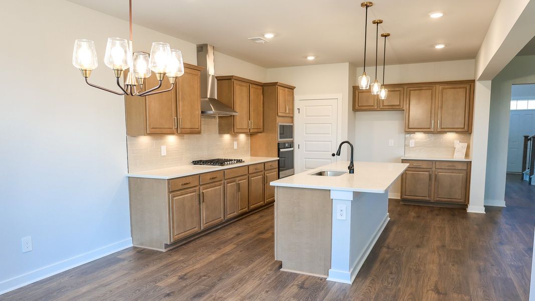 Representative furnished interior of a home built from the STONEBROOK II by D.R. Horton in Harvest Point, Spring Hill (Image 11).