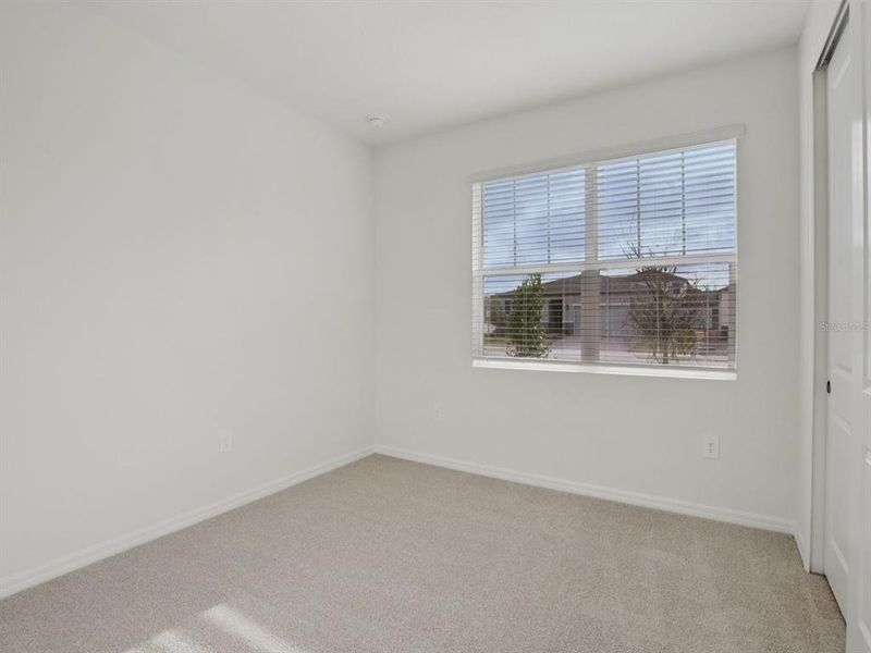 Spacious, unfurnished interior of a new home in Coasterra - Reserve Series, Palmetto (Image 12).