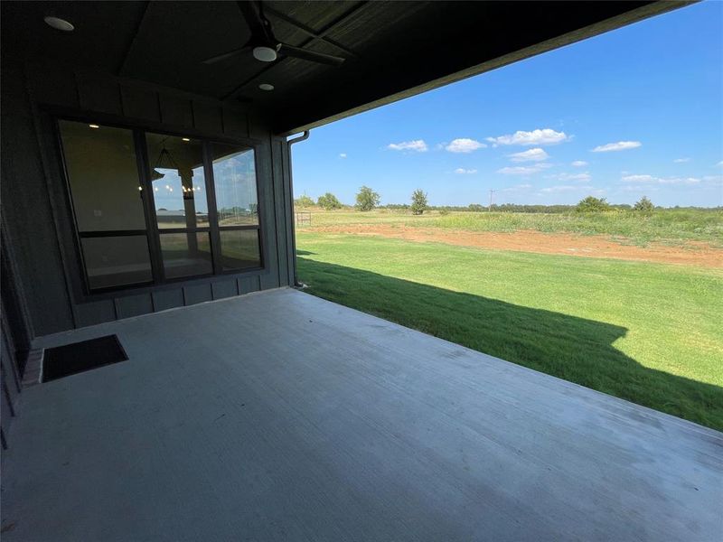 View of patio featuring ceiling fan