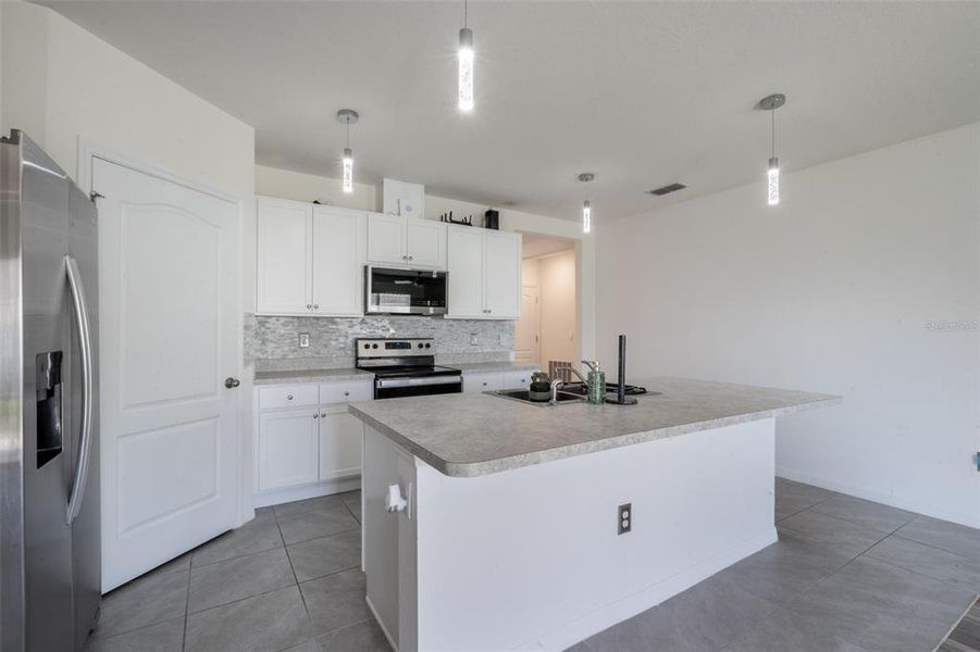 Furnished interior view inside a new home in Poinciana Enclave, Kissimmee (Image 8).