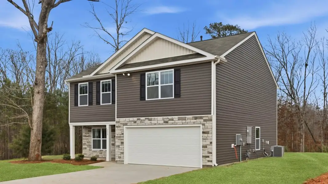 Front exterior of a new home in Cedar Gap, Fountain Inn, SC, highlighting curb appeal (Image 2). Front exterior of a new home in Cedar Gap, Fountain Inn, SC, highlighting curb appeal (Image 2).
