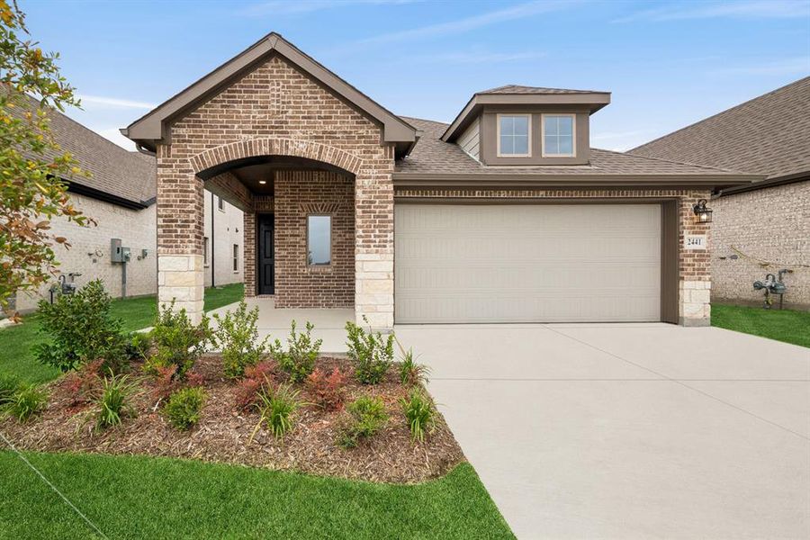 Front exterior of a new home in Creekshaw – Gardens, Royse City, TX, highlighting curb appeal (Image 1).