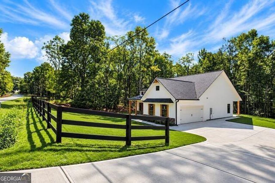 Front exterior of a new home in , Silver Creek, GA, highlighting curb appeal (Image 26). Front exterior of a new home in , Silver Creek, GA, highlighting curb appeal (Image 26).