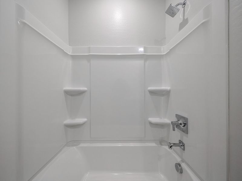 A bathroom with a toilet and sink. A bathroom with a toilet and sink.