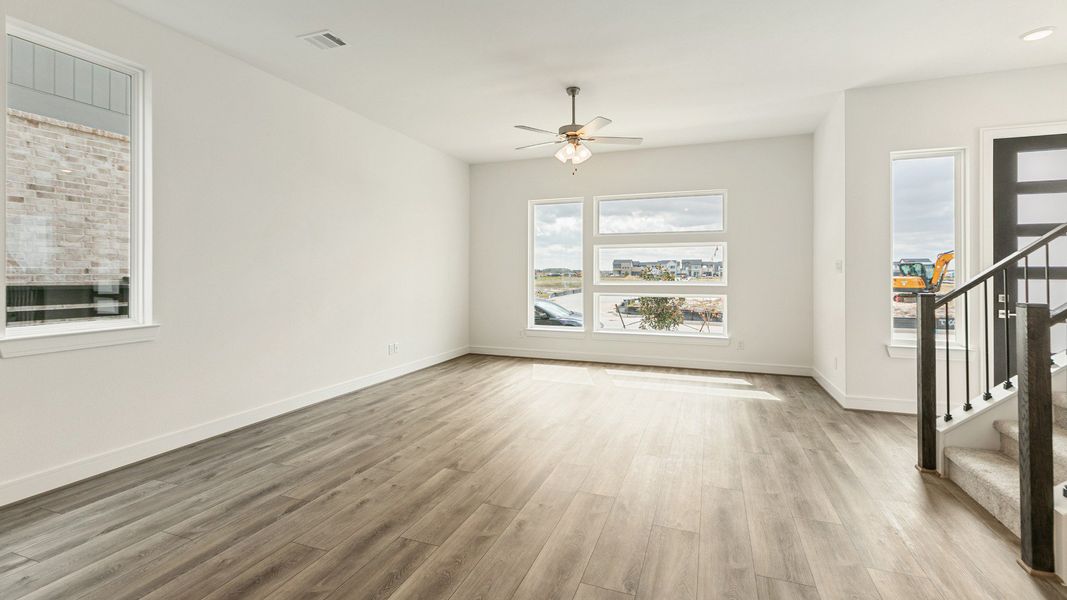 Representative furnished interior of a home built from the Valencia by Brightland Homes in Bridgeland Central, Cypress (Image 7).