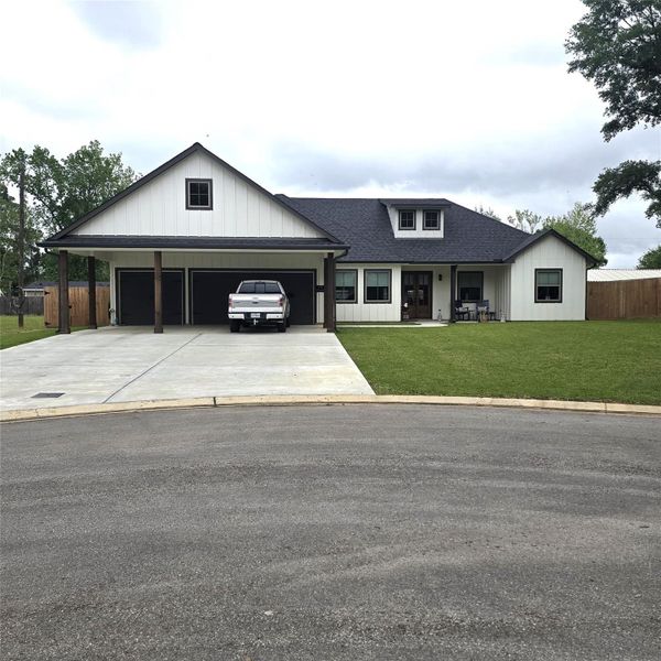 VIEW OF 3 CAR CARPORT AND EXTRA WIDE DRIVEWAY, WITH PLENTY OF ROOM FOR LARGE PICKUPS VIEW OF 3 CAR CARPORT AND EXTRA WIDE DRIVEWAY, WITH PLENTY OF ROOM FOR LARGE PICKUPS