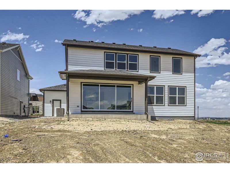 Exterior details and patio area of a home in RainDance, Windsor (Image 19).