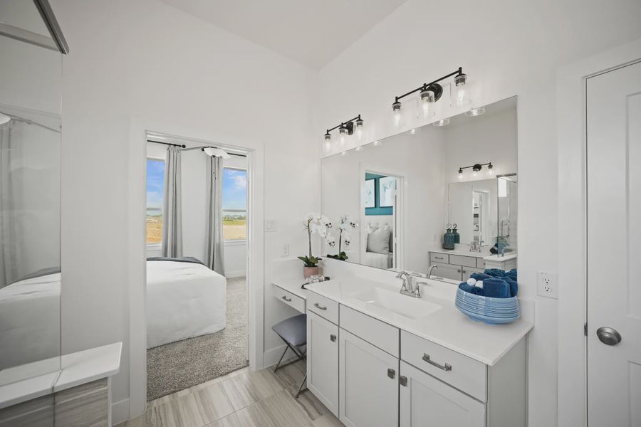 Representative furnished interior of a home built from the Athens by Chesmar Homes in Sunterra, Katy (Image 15).