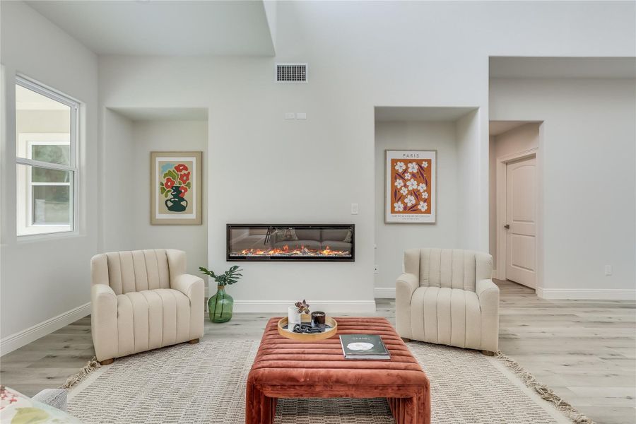 Living room with hardwood / wood-style flooring