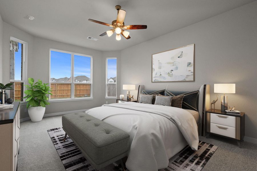 The primary bedroom is generously sized, creating a tranquil and spacious retreat that offers ample room for relaxation. Featuring plush carpet, high ceilings, fresh paint, and large windows that lets in natural lighting throughout the day.