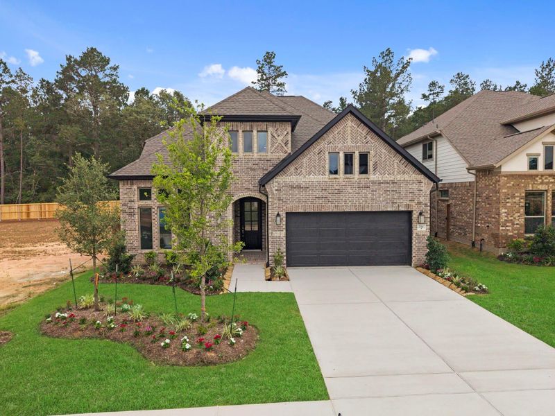 Front exterior of a new home in Wildtree, Magnolia, TX, highlighting curb appeal (Image 21).