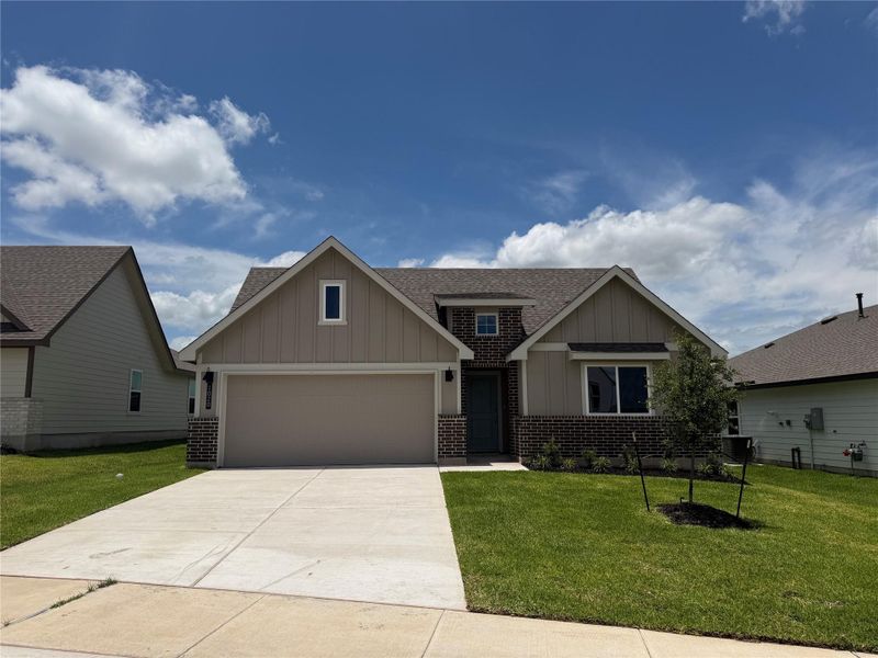 Front exterior of a new home in Liberty Village, Brenham, TX, highlighting curb appeal (Image 1). Front exterior of a new home in Liberty Village, Brenham, TX, highlighting curb appeal (Image 1).