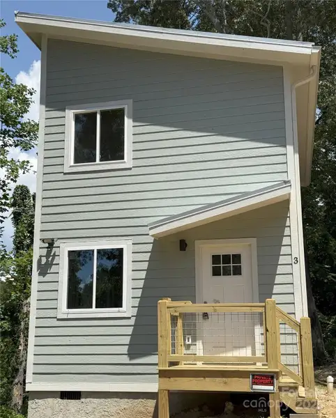 Exterior details and patio area of a home in , Asheville (Image 1).