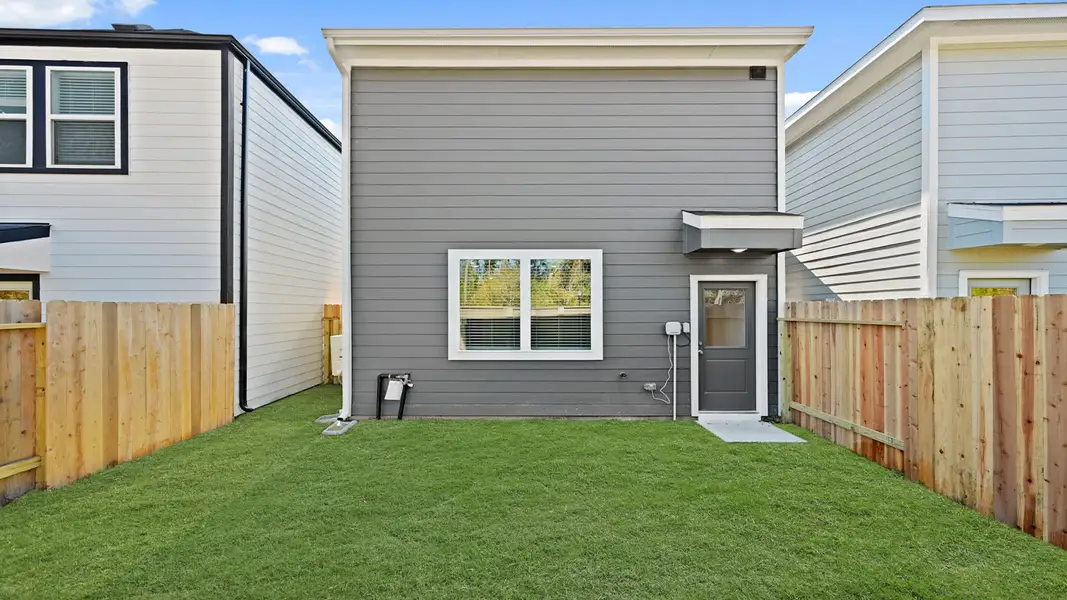 Representative exterior details of a home built from the 1293 by D.R. Horton in Bridges on Lake Houston Villas, Humble (Image 3).