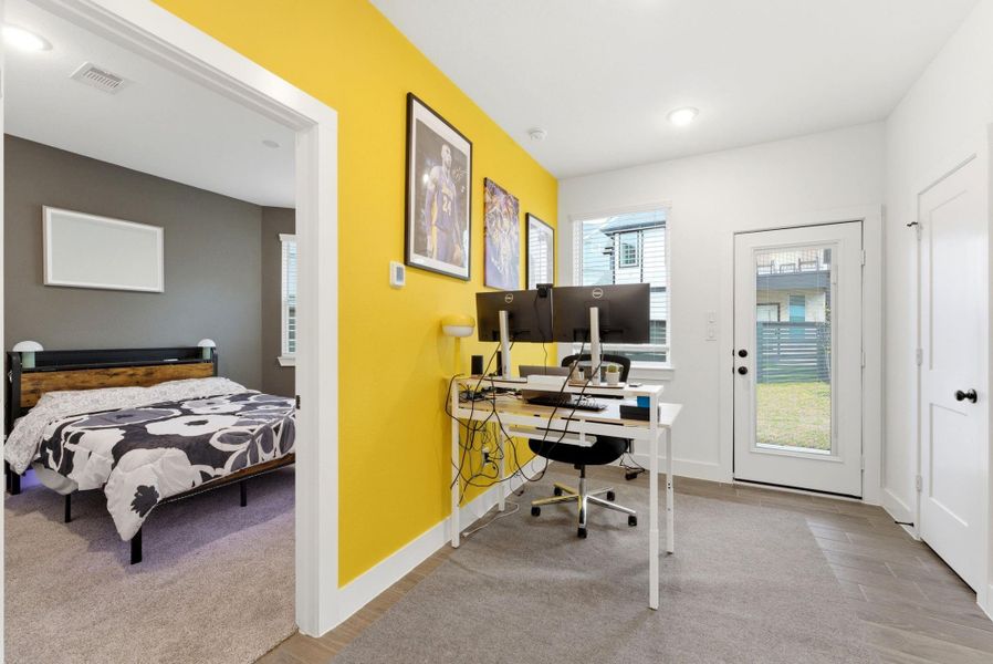 Light-filled office or flex room featuring backyard access—ideal for working from home with a refreshing outdoor break just steps away.