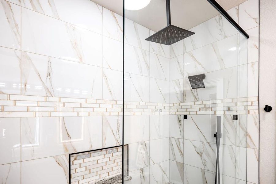 Bathroom featuring tiled shower