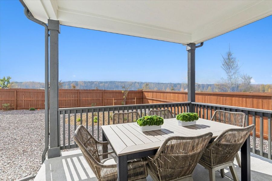 A table and chairs on a deck. A table and chairs on a deck.