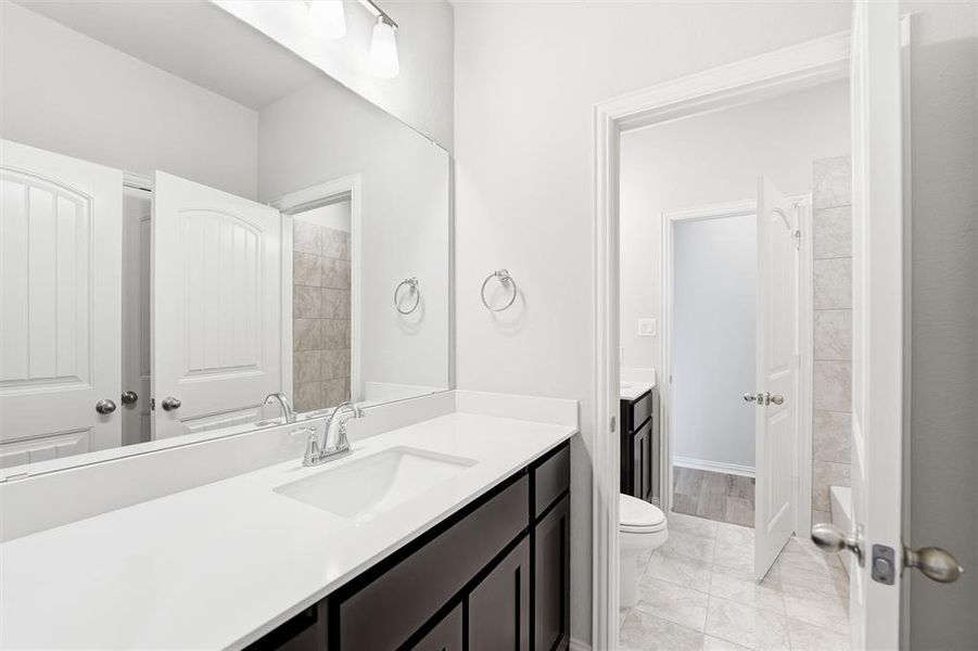 Full bathroom featuring vanity and shower / washtub combination
