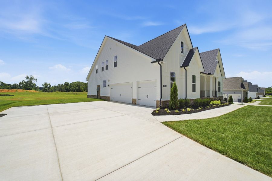 Front exterior of a new home in Belvoir, Fairview, TN, highlighting curb appeal (Image 2). Front exterior of a new home in Belvoir, Fairview, TN, highlighting curb appeal (Image 2).