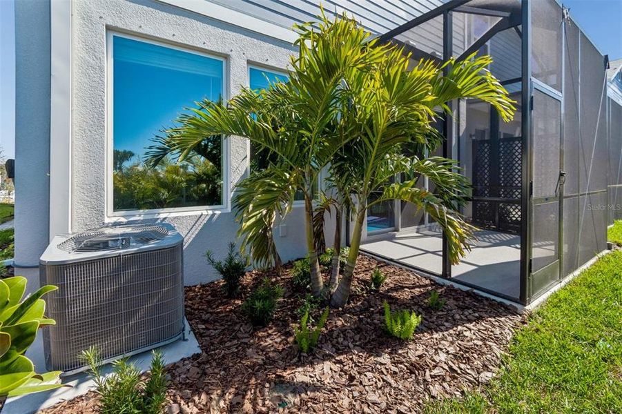 Exterior details and patio area of a home in North River Ranch – Townhomes, Parrish (Image 29).