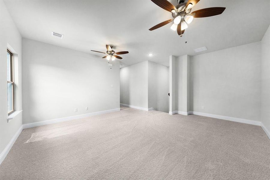 Unfurnished room with light colored carpet, a ceiling fan, and recessed lighting Unfurnished room with light colored carpet, a ceiling fan, and recessed lighting