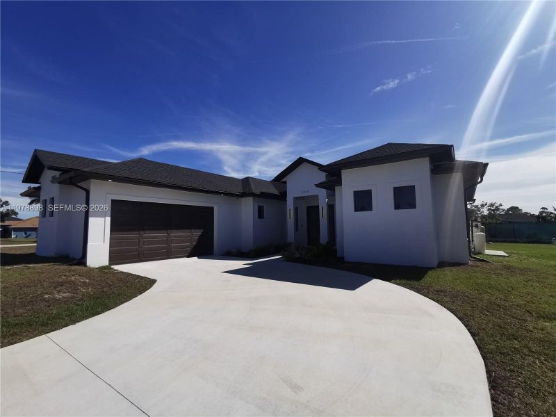 Front exterior of a new home in , Cape Coral, FL, highlighting curb appeal (Image 22).