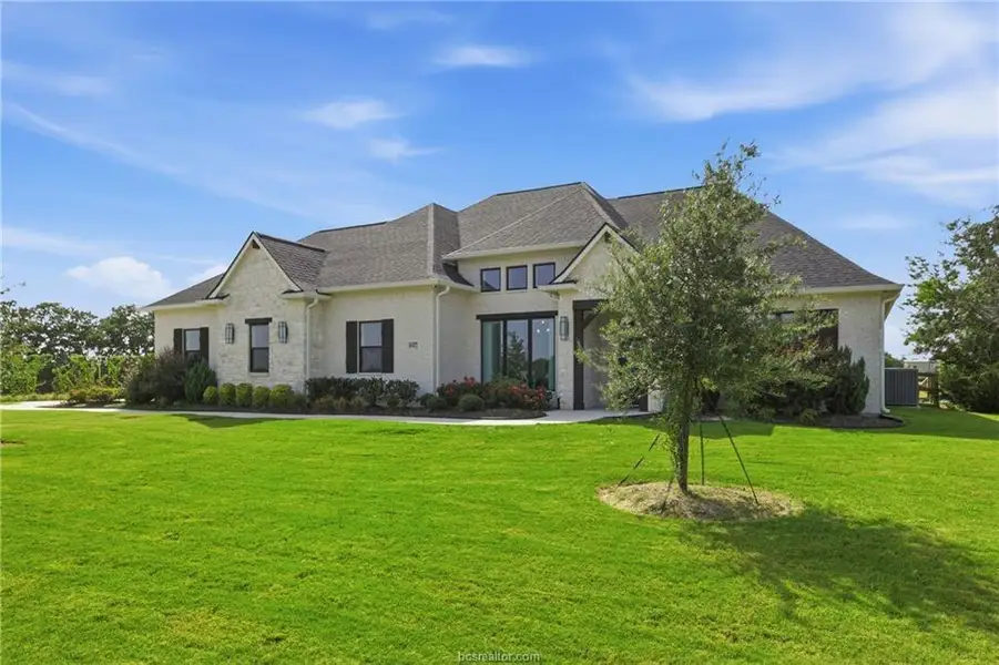 Front exterior of a new home in , Bryan, TX, highlighting curb appeal (Image 25).