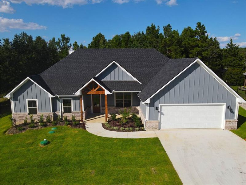 Front exterior of a new home in , Lindale, TX, highlighting curb appeal (Image 1). Front exterior of a new home in , Lindale, TX, highlighting curb appeal (Image 1).