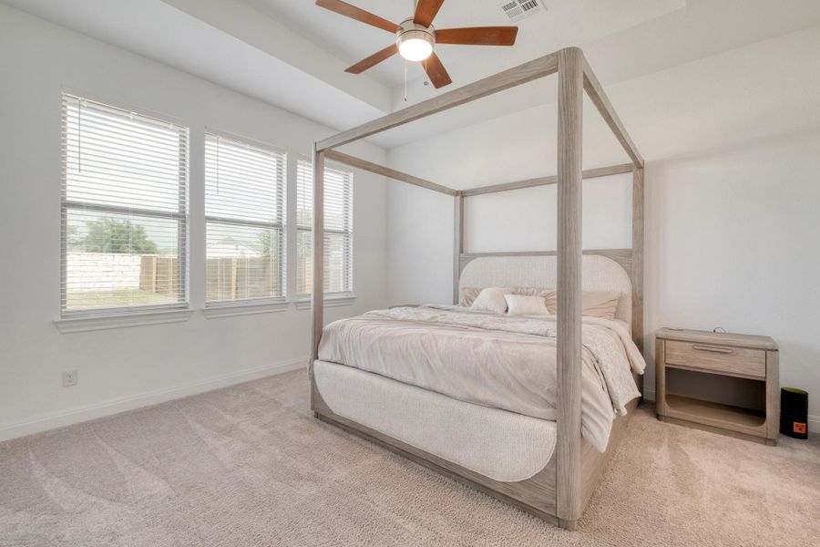 The main-floor primary suite keeps a little distance between you and the upstairs secondary bedrooms.