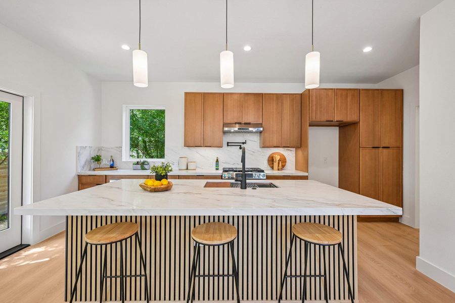 Culinary dreams come alive in this kitchen with a spacious island, complete with pendant lighting. Culinary dreams come alive in this kitchen with a spacious island, complete with pendant lighting.