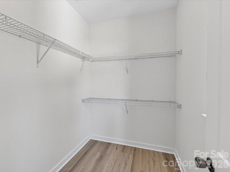 Ample space in the walk-in closet with ample shelving and storage options to keep your wardrobe organized. Ample space in the walk-in closet with ample shelving and storage options to keep your wardrobe organized.
