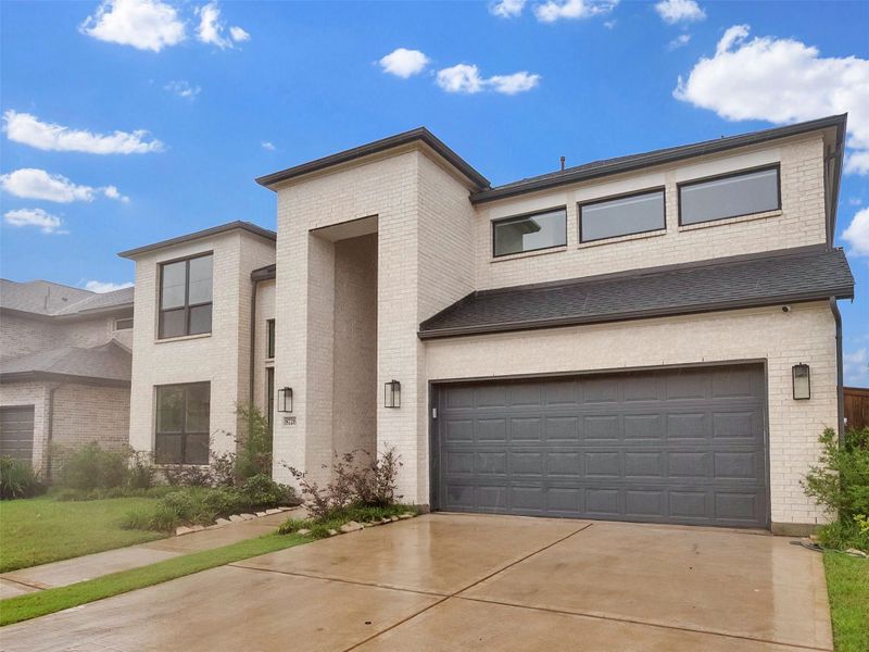 Front exterior of a new home in , Richmond, TX, highlighting curb appeal (Image 2). Front exterior of a new home in , Richmond, TX, highlighting curb appeal (Image 2).