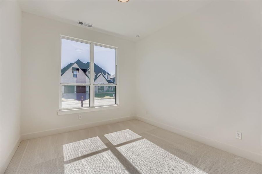 Unfurnished room with carpet floors and baseboards