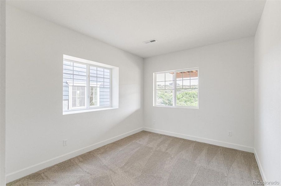 Spacious, unfurnished interior of a new home in Terrain Oak Valley, Castle Rock (Image 30).