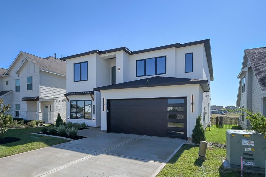 Front exterior of a new home in , Willis, TX, highlighting curb appeal (Image 2). Front exterior of a new home in , Willis, TX, highlighting curb appeal (Image 2).