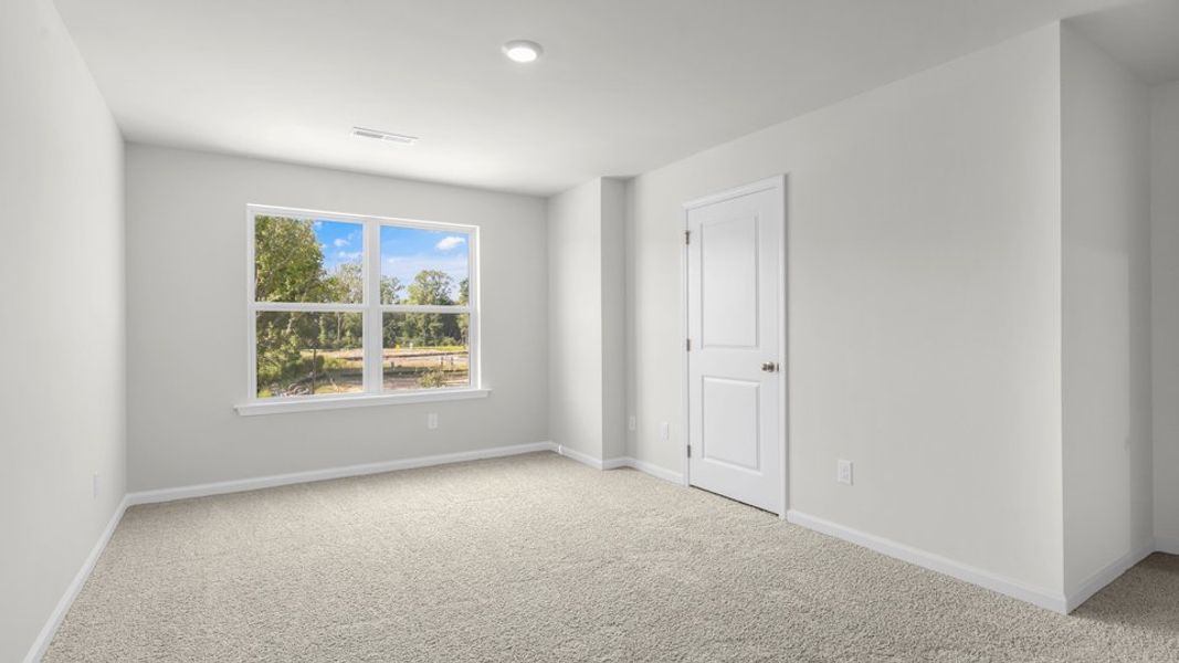 Spacious, unfurnished interior of a new home in The Townes at Belle Grove, Wendell (Image 23).