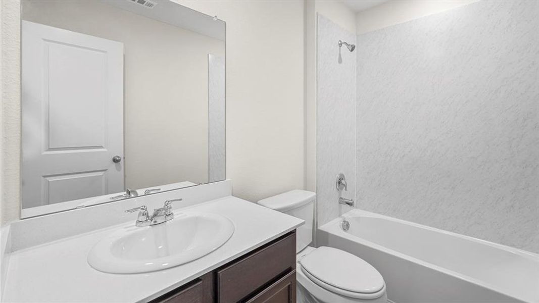 Full bathroom with vanity and washtub / shower combination