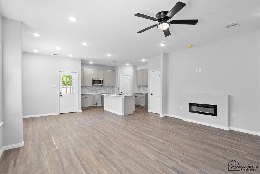 View as you walk in the front door. Open living room into the dining and kitchen area. View as you walk in the front door. Open living room into the dining and kitchen area.