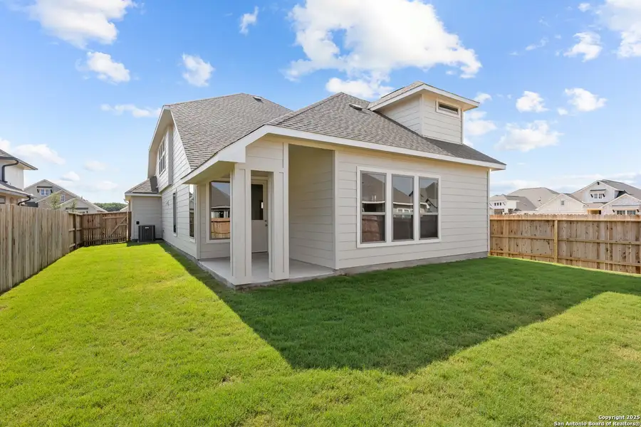 Front exterior of a new home in Megan's Landing, Castroville, TX, highlighting curb appeal (Image 11).