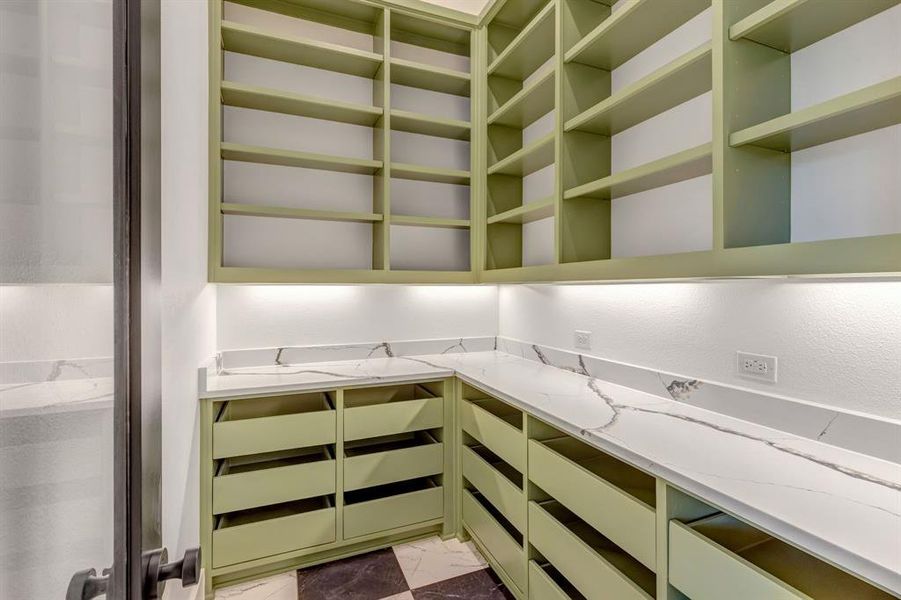 Spacious closet with marble look flooring
